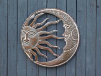 Zon en maan , muursculptuur